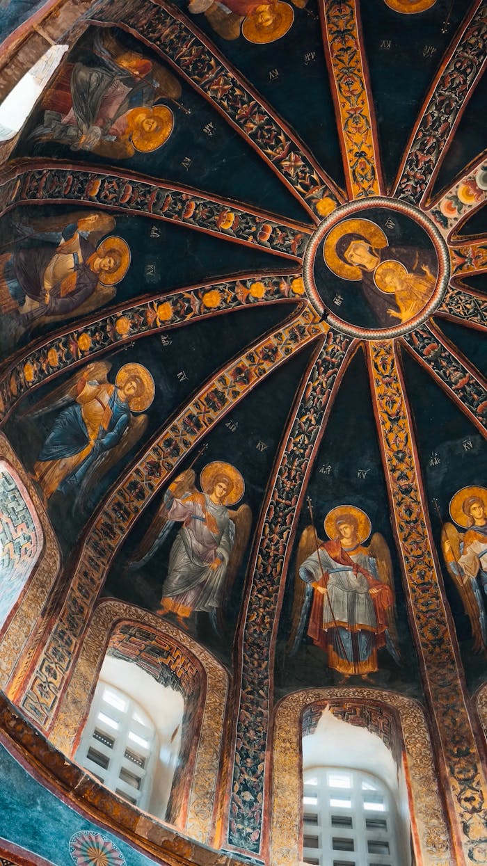 Stunning frescoes in a Byzantine dome represent religious figures in an ancient church.